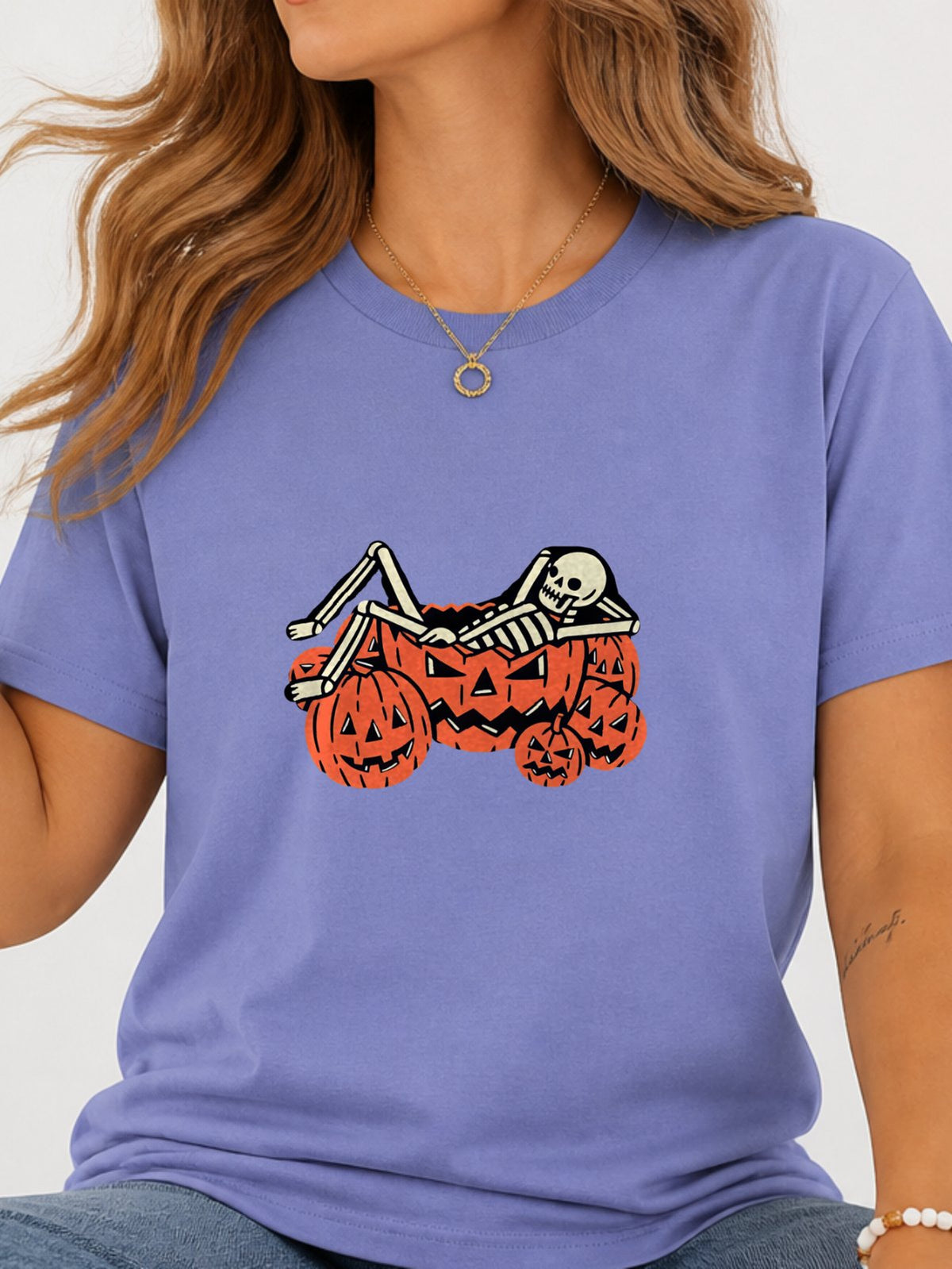 Skeleton Chilling In Pumpkin Graphic Tee - Violet Model