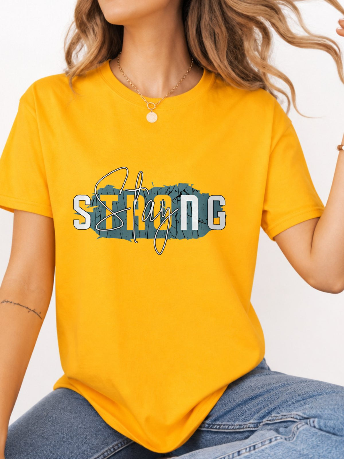Stay Strong Distressed Script Graphic T-Shirt - Gold Model