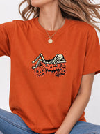 Skeleton Chilling In Pumpkin Graphic Tee - Texas Orange Model
