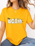 Try Again Cartoon Text Quote Graphic T-Shirt - Gold Model